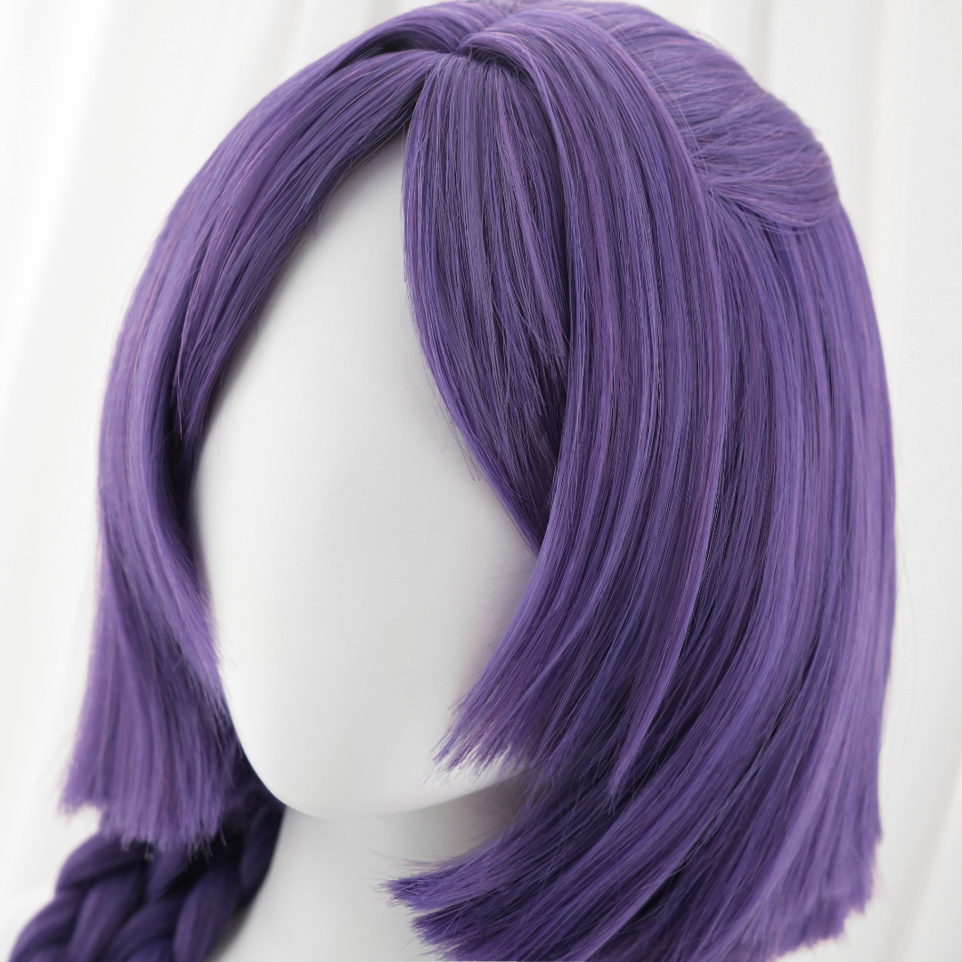 Purple wig on a mannequin head against a white background