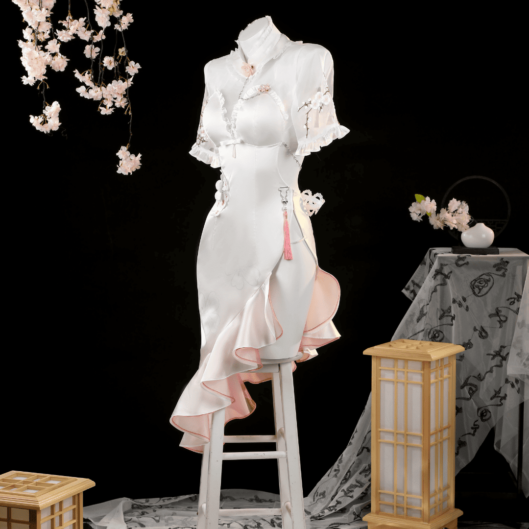White traditional outfit on a mannequin with cherry blossom decorations and a lantern in the background